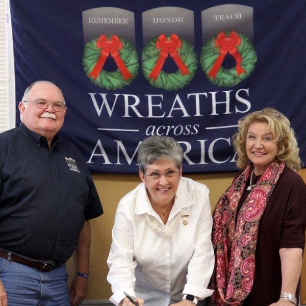 Wreaths Across America Chairman of the Board Wayne Hanson, 2016 President of American Gold Star Mothers, Inc., Candy Martin and Wreaths Across America Executive Director Karen Worcester sign a formal nationwide partnership on Oct. 20, 2016. (PRNewsFoto/Wreaths Across America)